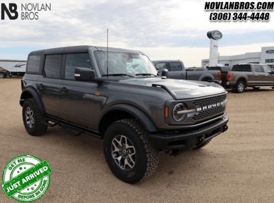 A grey 2024 Ford Bronco Badlands for sale at the Novlan Bros dealership in Saskatchewan.