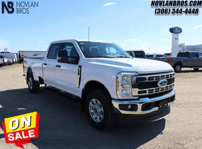 A white 2024 Ford F-250 XLT Super Duty for sale at the Novlan Bros dealership in Saskatchewan.