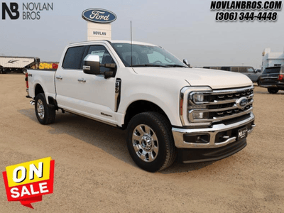 A white 2024 Ford F-350 King Ranch for sale at the Novlan Bros dealership in Saskatchewan.