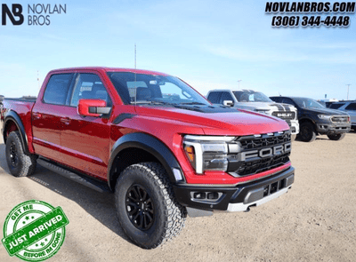 A red 2024 Ford F-150 Raptor for sale at the Novlan Bros dealership in Saskatchewan.