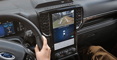 Interior view of the 2024 Ford Ranger XL, showcasing the centre stack streaming images from the rearview camera.