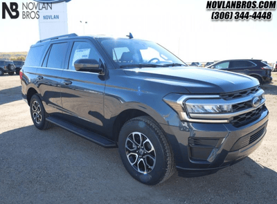 A blue 2024 Ford Expedition XLT for sale at the Novlan Bros dealership in Saskatchewan.