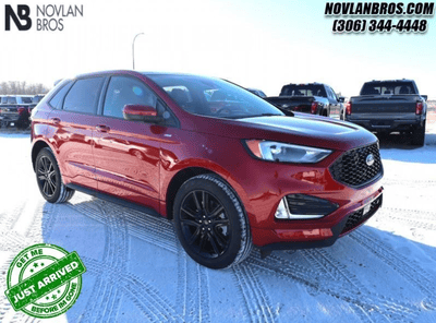 A red 2024 Ford Edge ST Line for sale at the Novlan Bros dealership in Saskatchewan.