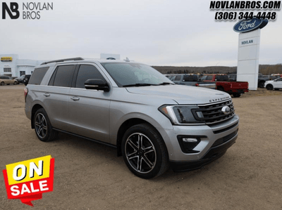 A silver 2021 Ford Expedition Limited for sale at the Novlan Bros dealership in Saskatchewan.