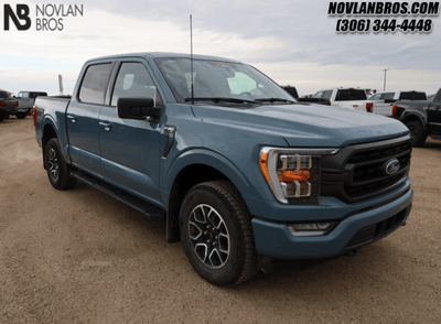 A blue 2023 Ford F-150 XLT for sale at the Novlan Bros dealership in Saskatchewan/