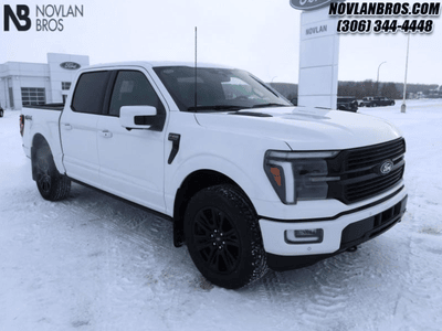 A white 2025 Ford F-150 Platinum for sale at the Novlan Bros dealership in Saskatchewan.