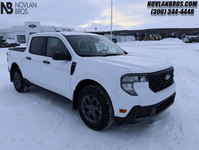 A white 2025 Ford Maverick XLT for sale at the Novlan Bros dealership in Saskatchewan.