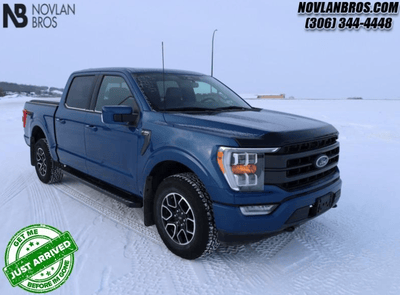 A blue 2022 Ford F-150 Lariat for sale at the Novlan Bros dealership in Saskatchewan.