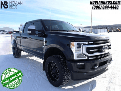 A black 2021 Ford F-350 Platinum for sale at the Novlan Bros dealership in Saskatchewan.