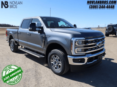 A silver 2024 Ford F-250 Super Duty Lariat for sale at the Novlan Bros dealership in Saskatchewan.