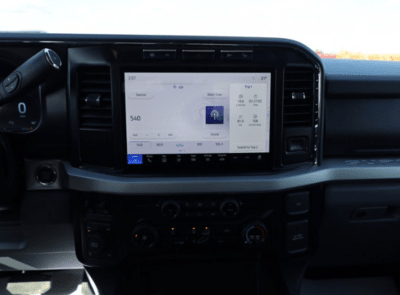 Interior view of the 2024 Ford F-350 XLT, showcasing the eight-inch touchscreen and SYNC 4 infotainment system.