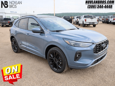 A blue 2024 Ford Escape ST-Line Elite for sale at the Novlan Bros dealership in Saskatchewan.