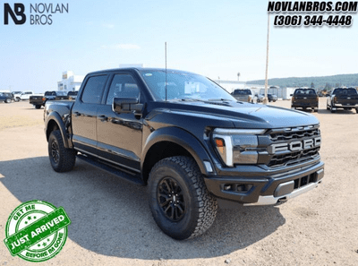 A black 2024 Ford F-150 Raptor for sale at the Novlan Bros dealership in Saskatchewan.