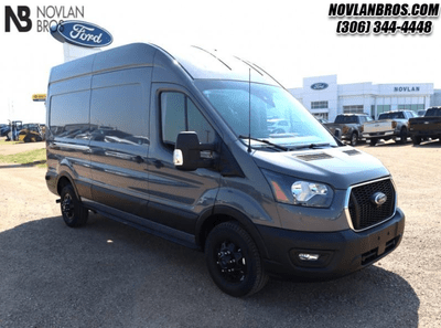 A grey 2024 Ford Transit Cargo Van for sale at the Novlan Bros dealership in Saskatchewan.