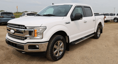 A white 2020 Ford F-150 XLT for sale at the Novlan Bros dealership in Saskatchewan.