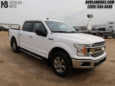 A white 2020 Ford F-150 XLT for sale at the Novlan Bros dealership in Saskatchewan.