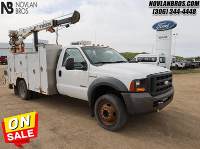 A white 2005 Ford F-550 Super Duty XL for sale at the Novlan Bros dealership in Saskatchewan.