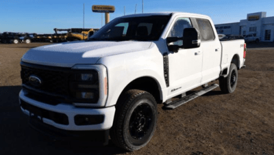 A white 2023 Ford F-250 XLT Super Duty parked at the Novlan Bros dealership.