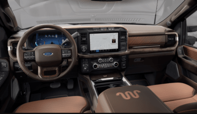Interior view of the 2023 Ford F-250 King Ranch, showcasing the leather seats, steering wheel, and SYNC 4 touchscreen.