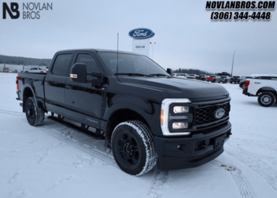 A black 2023 Ford F-350 XLT Premium Package parked at the Novlan Bros lot in Saskatchewan.