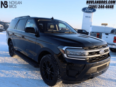 A black 2024 Ford Expedition XLT parked at the Novlan Bros dealership in Saskatchewan.