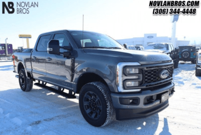 A black 2024 Ford F-350 Lariat Super Duty parked at the Novlan Bros dealership in Saskatchewan.