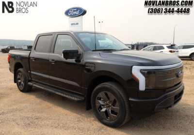 A black 2023 Ford F-150 Lariat with the High Package parked at the Novlan Bros dealership in Saskatchwan.