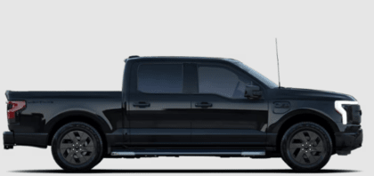 A black 2023 Ford F-150 Lightning XLT shown from the side and posed against a white background.