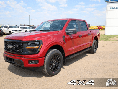 A red 2024 Ford F-150 STX for sale at the Novlan Bros dealership in Saskatchewan.