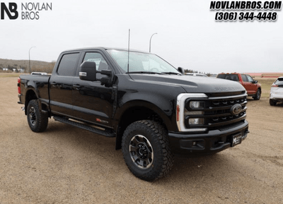 A black 2024 Ford F-350 Platinum for sale at the Novlan Bros dealership in Saskatchewan.