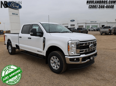 A white 2024 Ford F-350 XLT for sale at the Novlan Bros dealership in Saskatchewan.