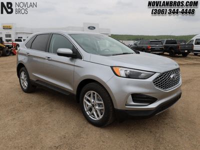 A silver 2024 Ford Edfe SEL for sale at the Novlan Bros dealership in Saskatchewan.