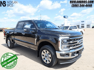 A black 2024 Ford F-350 Lariat Super Duty for sale at the Novlan Bros dealership in Saskatchewan.