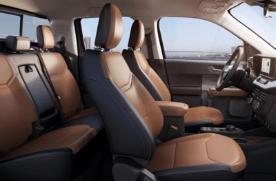 Interior view of the 2024 Ford Maverick Lariat, showcasing the ActiveX seats, steering wheel, and dashboard.
