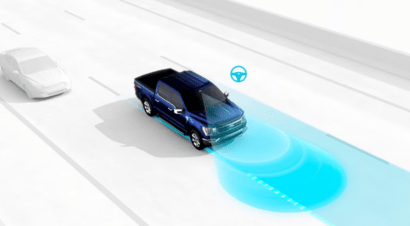 Digital rendering of a 2023 Ford F-150 Platinum, using lane-centring technology to assess alignment, as showcased by a blue light pattern.
