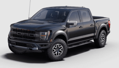 A black 2023 Ford F-150 Raptor shown from the side and posed against a white background.