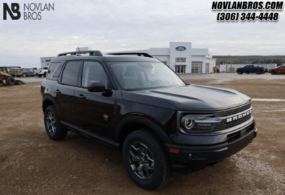 A black 2024 Ford Bronco Sport Badlands parked at the Novlan Bros dealership in Saskatchewan.