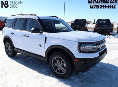 A white 2024 Ford Bronco Sport Big Bend parked at the Novlan Bros dealership in Saskatchewan.