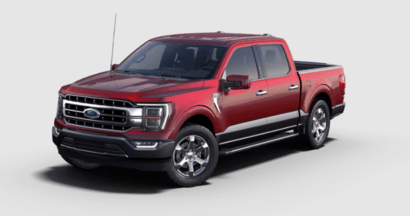 A red 2023 Ford F-150 Lariat truck posed against a white background.