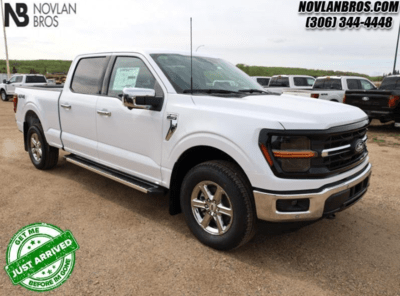 A white 2024 Ford F-150 XLT for sale at the Novlan Bros dealership in Saskatchewan.