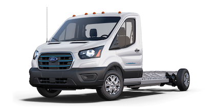 A white and black 2023 Ford E-Transit Cutaway posed against a white background.