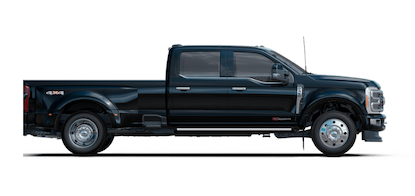 A dark blue 2023 Ford F-450 Limited Super Duty posed against a white background.